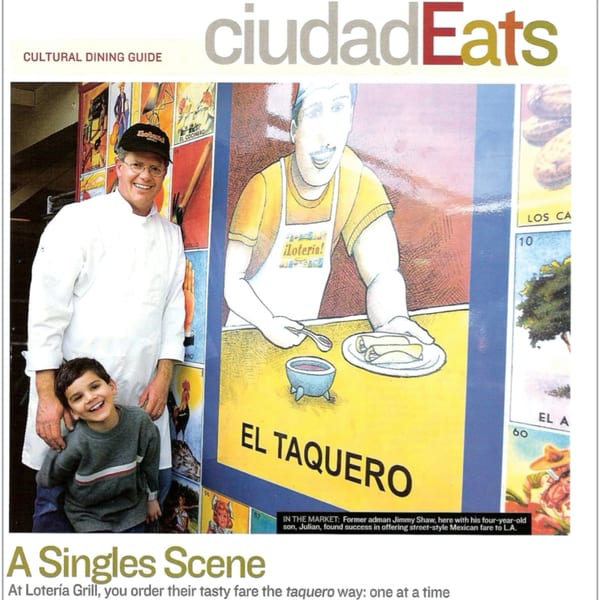 Loteria Grill owner Jimmy Shaw and his son Julian stand before a colorful "El Taquero" mural.